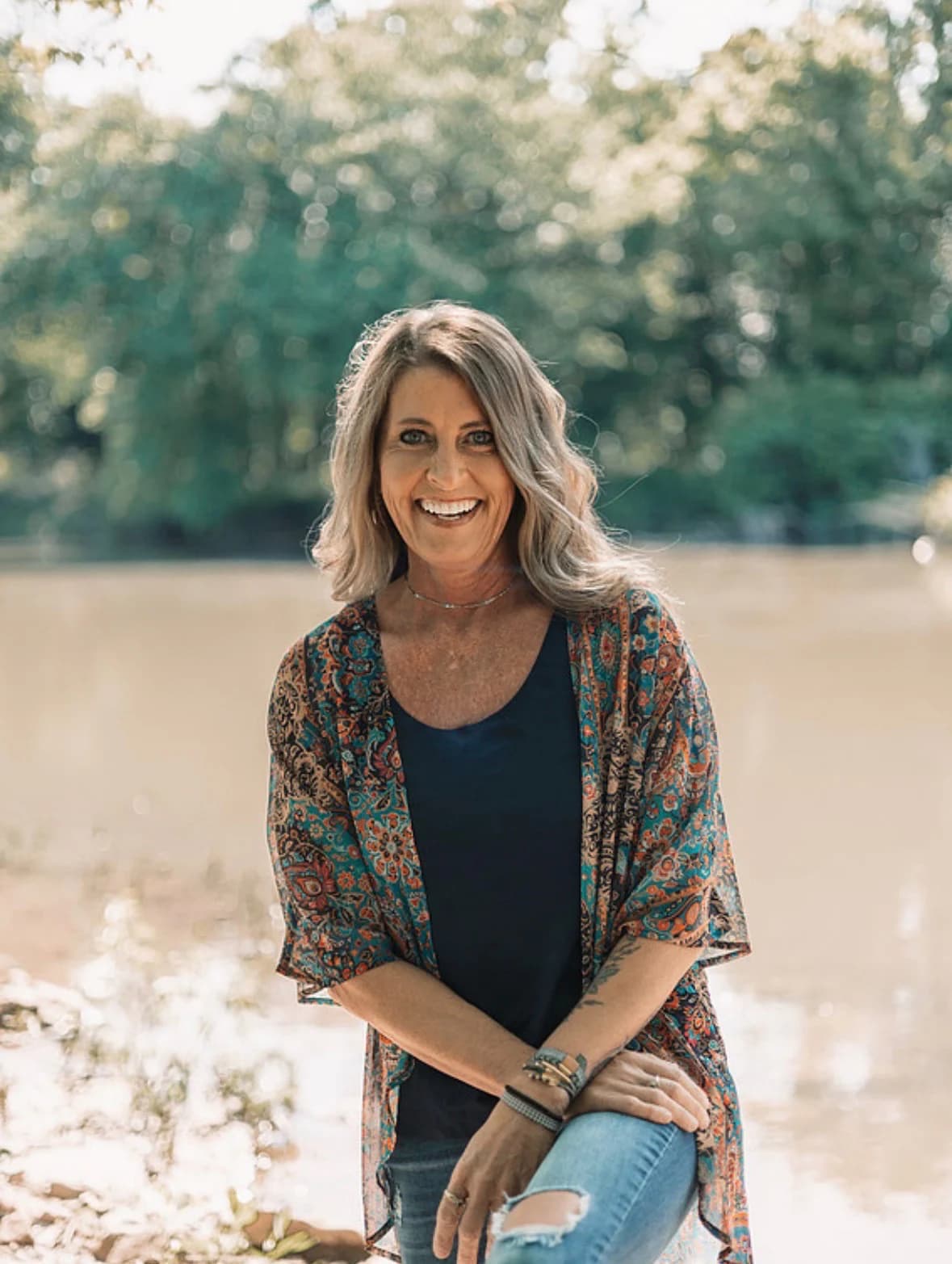 Kandace Cain smiling by a river